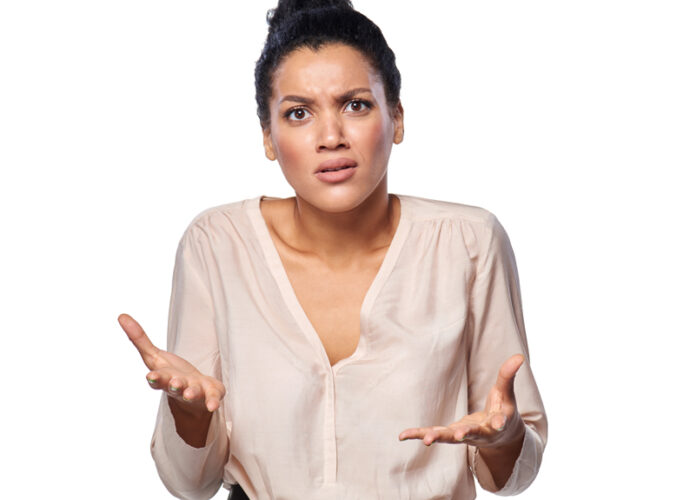 An attractive women with a puzzled expressing as if she is asking why me.