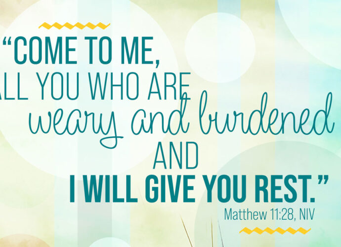 multicolored green abstract background with the words of Matthew 11:28 written across it.