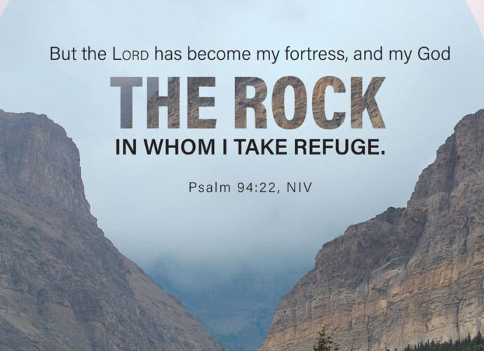 Clouds and two parted mountains in the background, with Psalm 94:22 NIV written across