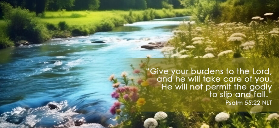 water streaming over the rocks in a river and a beautiful river bank with flowers. Psalm 55:22 nlt written across. depicting our full surrender to Jesus Christ