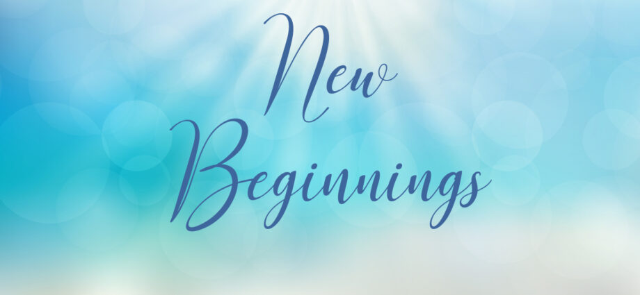 Beautiful sunlit ocean blue sky background with the words New Beginnings written across