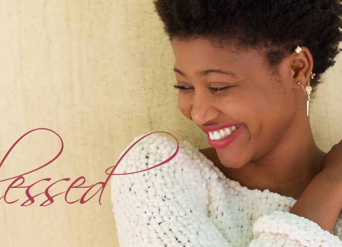 A beautiful woman smiling and feeling blessed