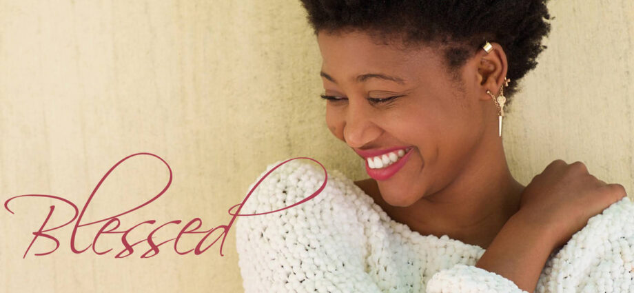 A beautiful woman smiling and feeling blessed