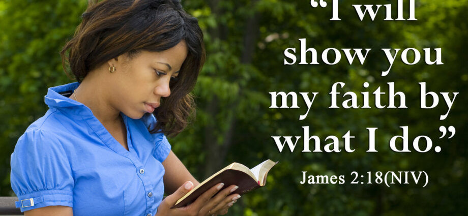 Beautiful young woman in the park reading the bible. John 2:18 NIV in the foreground.