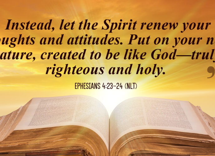 Sun brightly shining behind an Bible with the words of Ephesians 4;23-24 (NLT) written in the foreground.